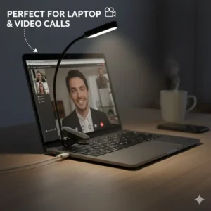 A mini clip on light attached to the top of a laptop screen for video call lighting.