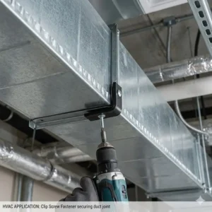 Real-world application of a heavy-duty clip screw fastener used to join galvanized steel sections of an HVAC duct.