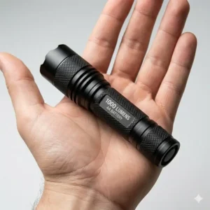A person holding the brightest aa flashlight in their hand to demonstrate its compact EDC size.