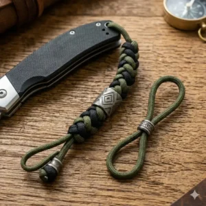 Illustration showing the components of a knife lanyard including a decorative metal bead and a durable box knot weave.